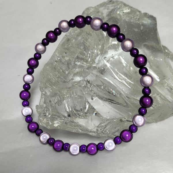 BR469 Purple and mauve miracle bead elasticated bracelet