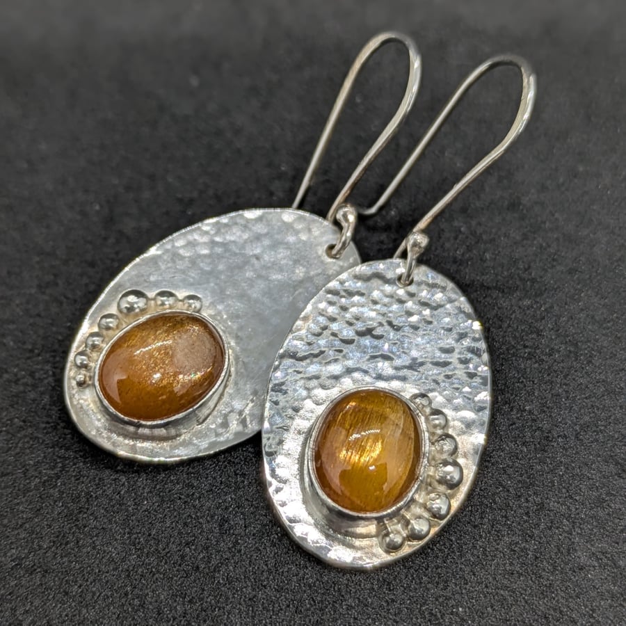 Handcrafted sterling silver earrings with sun stones
