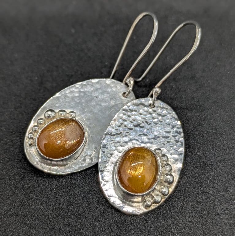 Handcrafted sterling silver earrings with sun stones