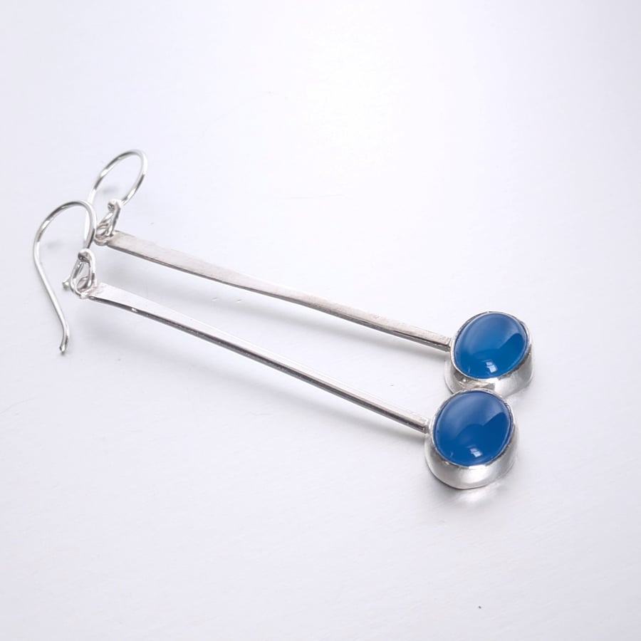 Eye catching long dangle blue onyx earrings