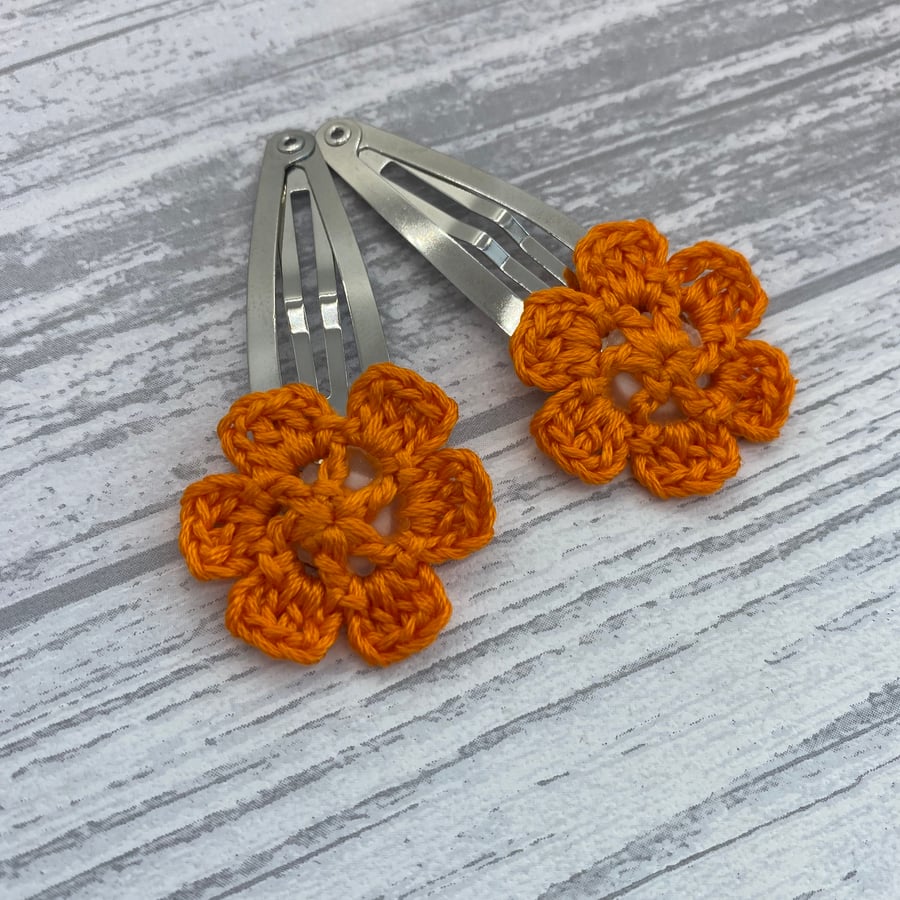 Girl’s hair clips, pair of flower clips in bright orange