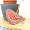 Ceramic bird decoration with patterned wing and tail 
