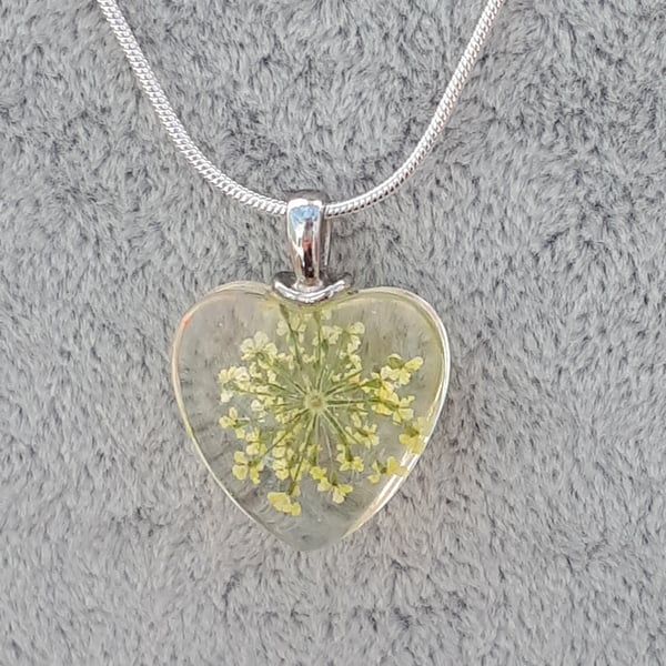 Yellow dried flower glass pendant on silver chain