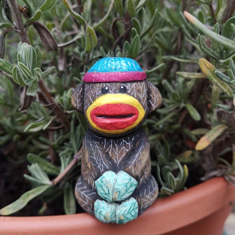 Hand carved, painted and finished wooden Simon the sock monkey