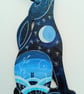 Sitting hare with a blue landscape