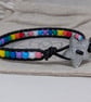 Pride flag beaded bracelet with black leather and star button - Image 3