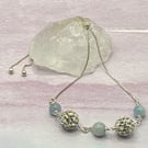 Silver plated slider bracelet with aquamarine stones and sparkly resin beads