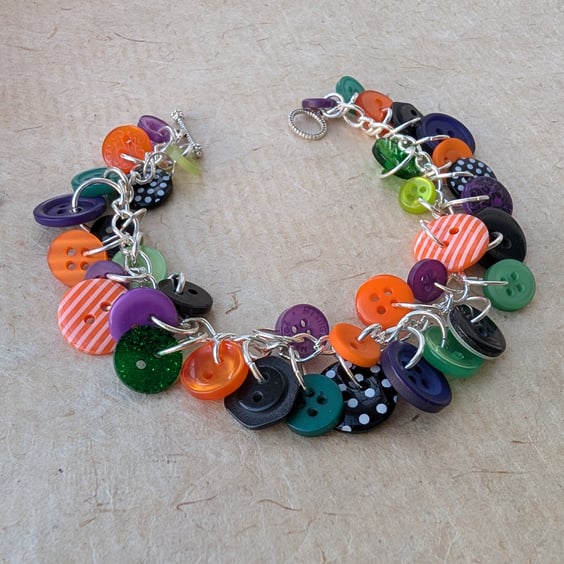 Halloween themed purple, green, black and orange button bracelet