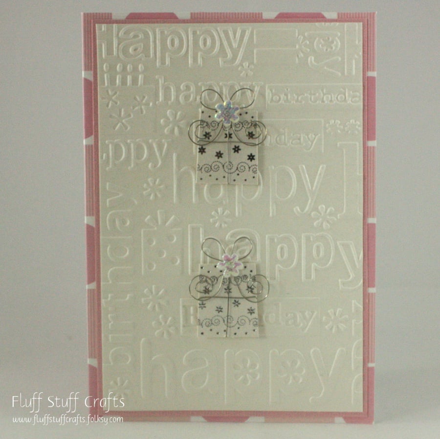 Embossed pink and ivory birthday card with gifts