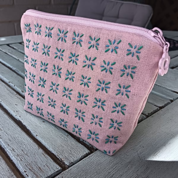 Handmade pink linen purse with sashiko embroidered detail.