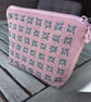 Handmade pink linen purse with sashiko embroidered detail.