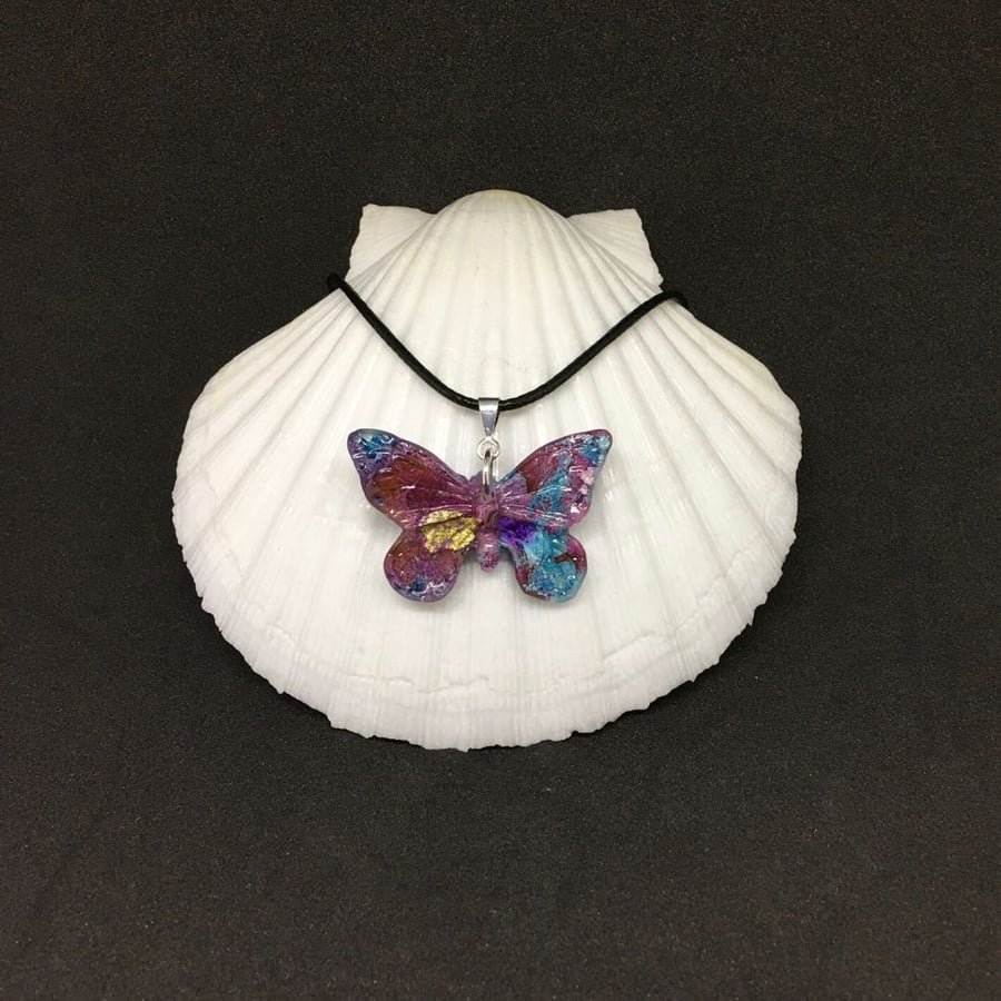 Butterfly multicoloured resin and ink necklace.