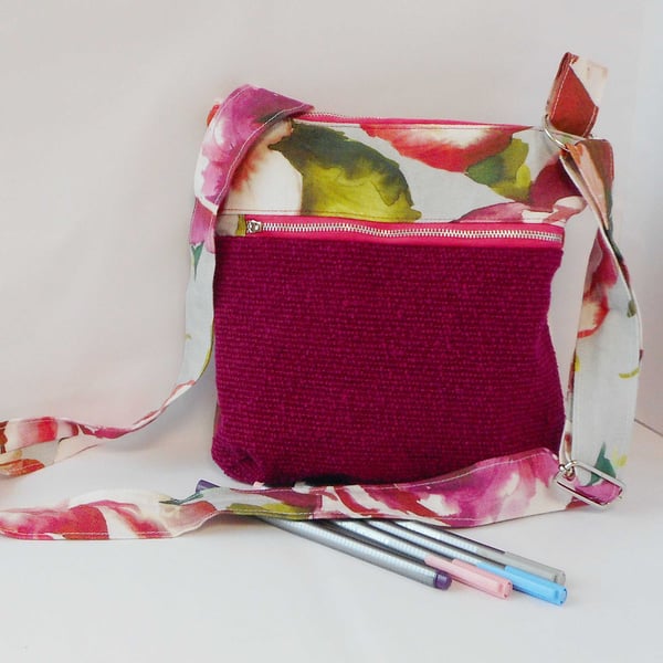 Fabric crossbody bag with zipped pocket on front in bright magenta