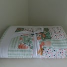 Handmade, quilted baby blanket for the nursery.