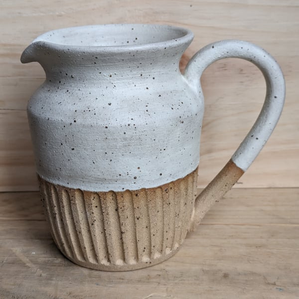 Larger matte cream carved jug (shoulder)