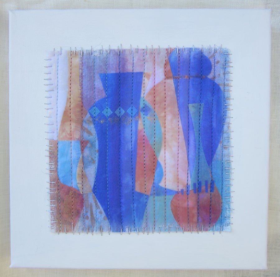  Abstract blue and peach fabric art. Collage on canvas. Textile picture