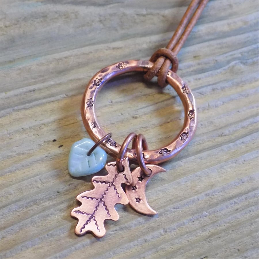 Chunky aged copper hoop 'moon and leaves' charm pendant 