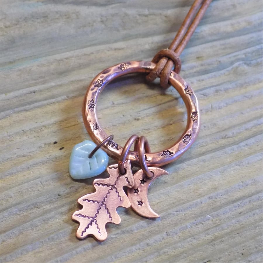 Chunky aged copper hoop 'moon and leaves' charm pendant 