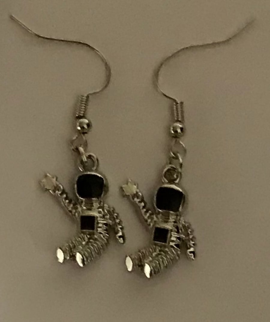 Silver astronaut earrings
