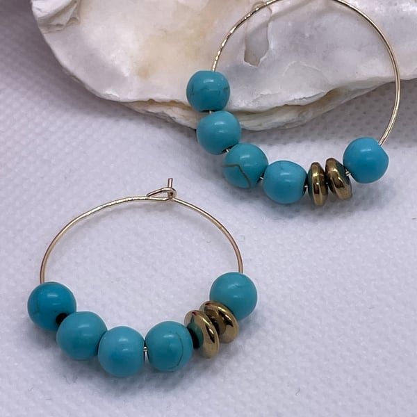 Gold plated hoops with turquoise howlite beads