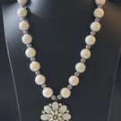 Beaded necklace with flower pendant
