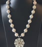 Beaded necklace with flower pendant