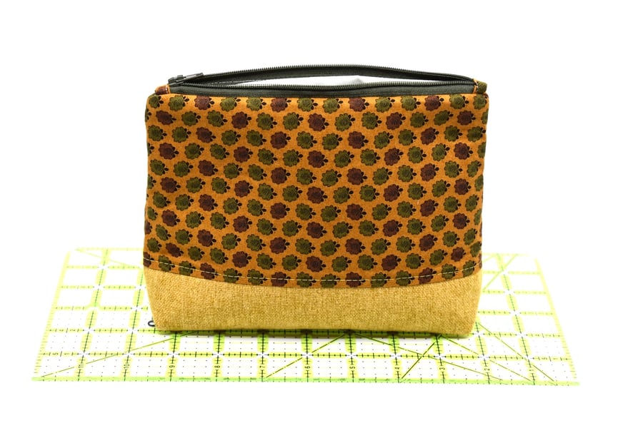 An attractive and smart storage pouch with zip top and strong lining.