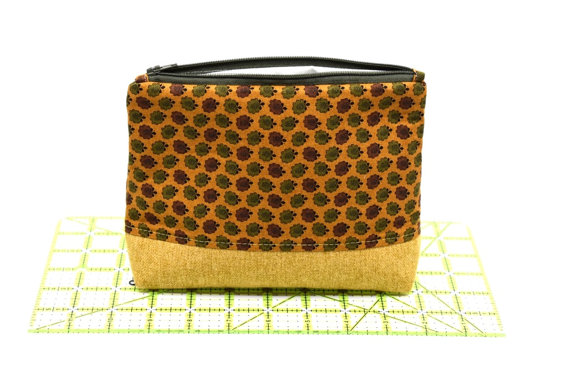 An attractive and smart storage pouch with zip top and strong lining.