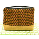 An attractive and smart storage pouch with zip top and strong lining.