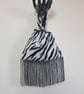  Animal print faux fur fabric Japanese Knot bag with 13cm black tassel trim 