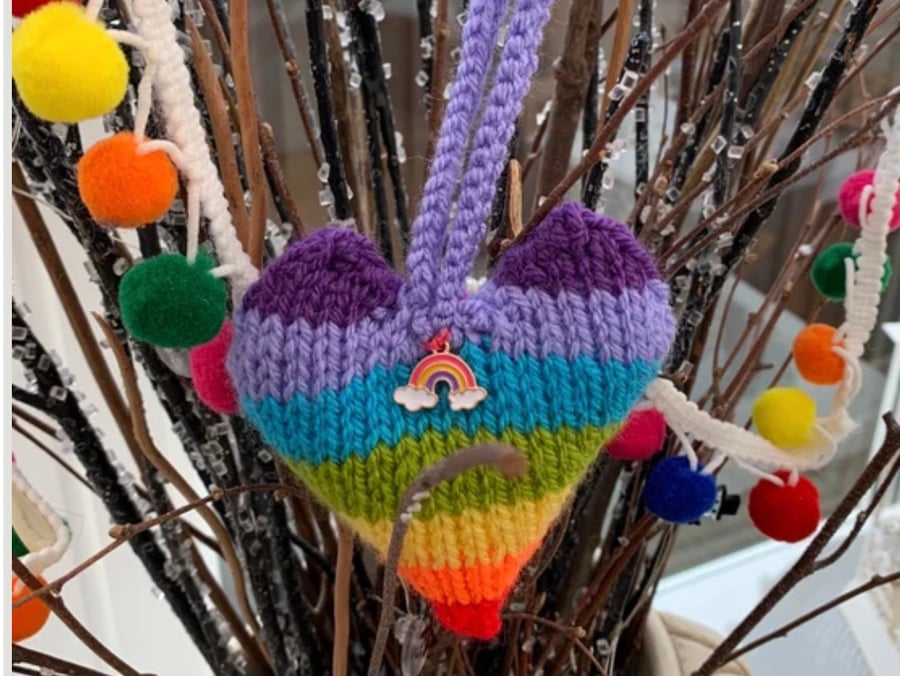 Knitted rainbow decoration with rainbow charm 