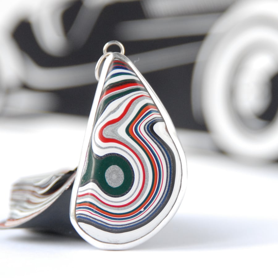 Kenworth fordite pendant (bottle green eye)