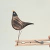 Pecking peg bird