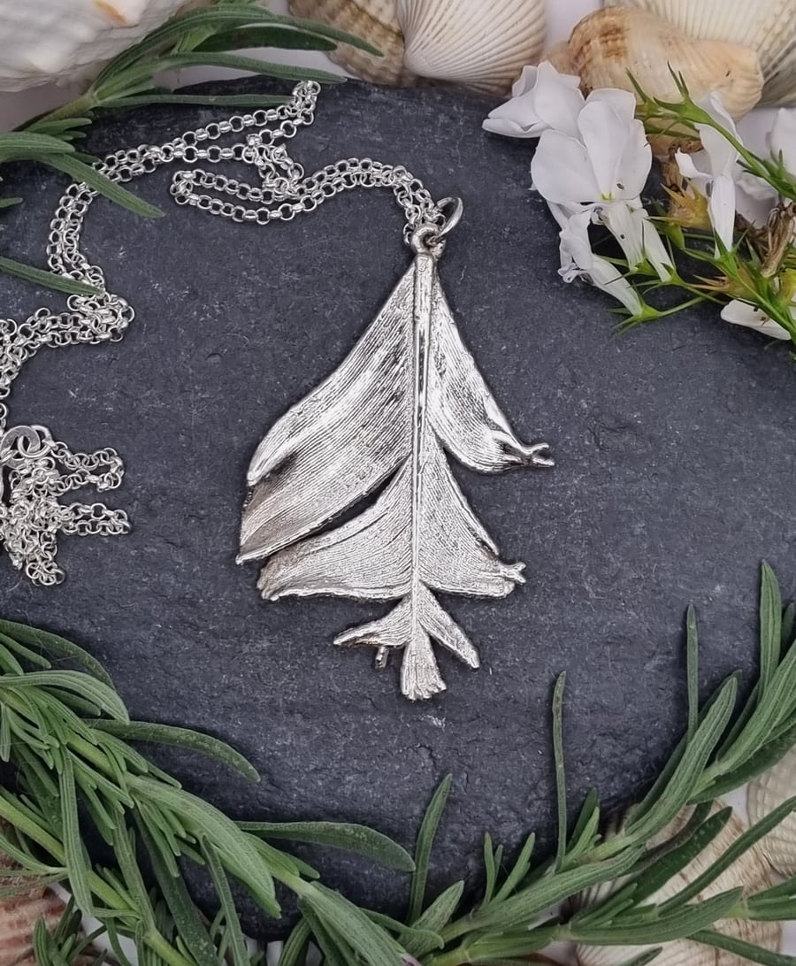 Real feather preserved in silver pendant necklace