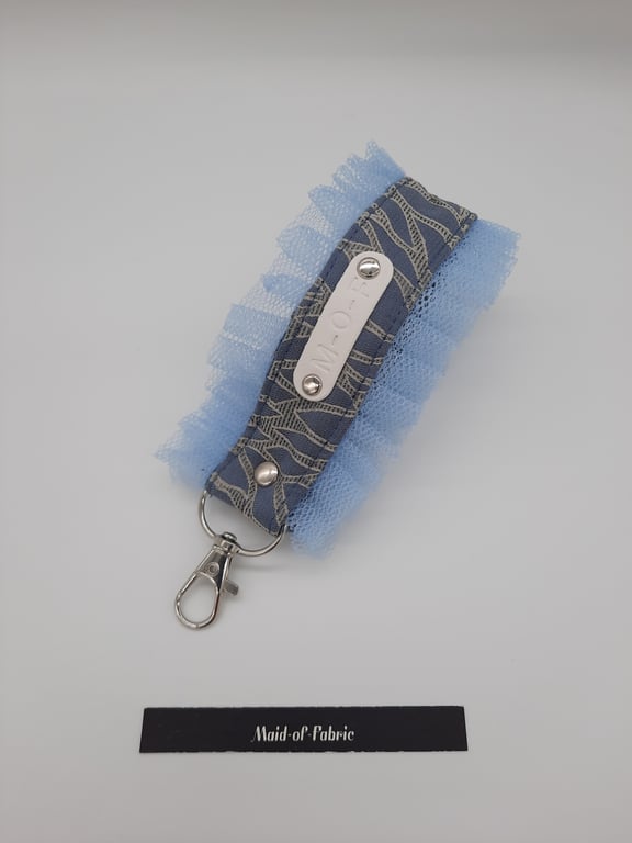 Keyring fob, wristlet in blue with tulle frills. 