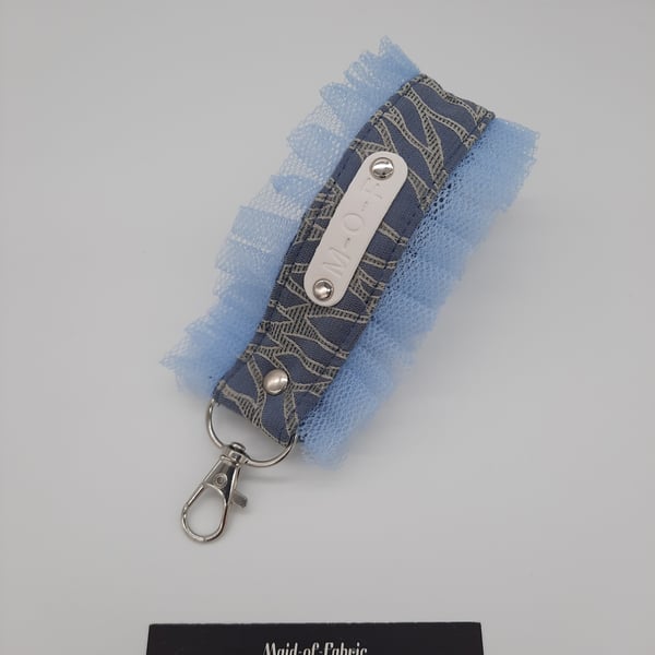 Keyring fob, wristlet in blue with tulle frills. 