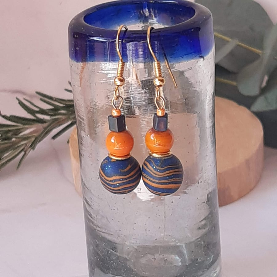 Orange and royal blue dangly polymer clay earrings