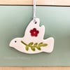 Teeny ceramic dove decoration with leaves and red flower