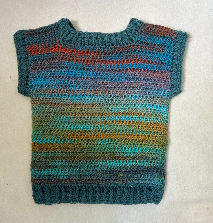 Sleeveless jumper in blues and greens with chunky rib and cuffs.