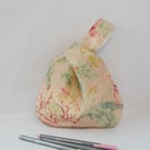 Pink floral Japanese Knot bag in 100% linen print