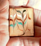 brooch - rectangular - scrolled rod on clear enamel - Image 1