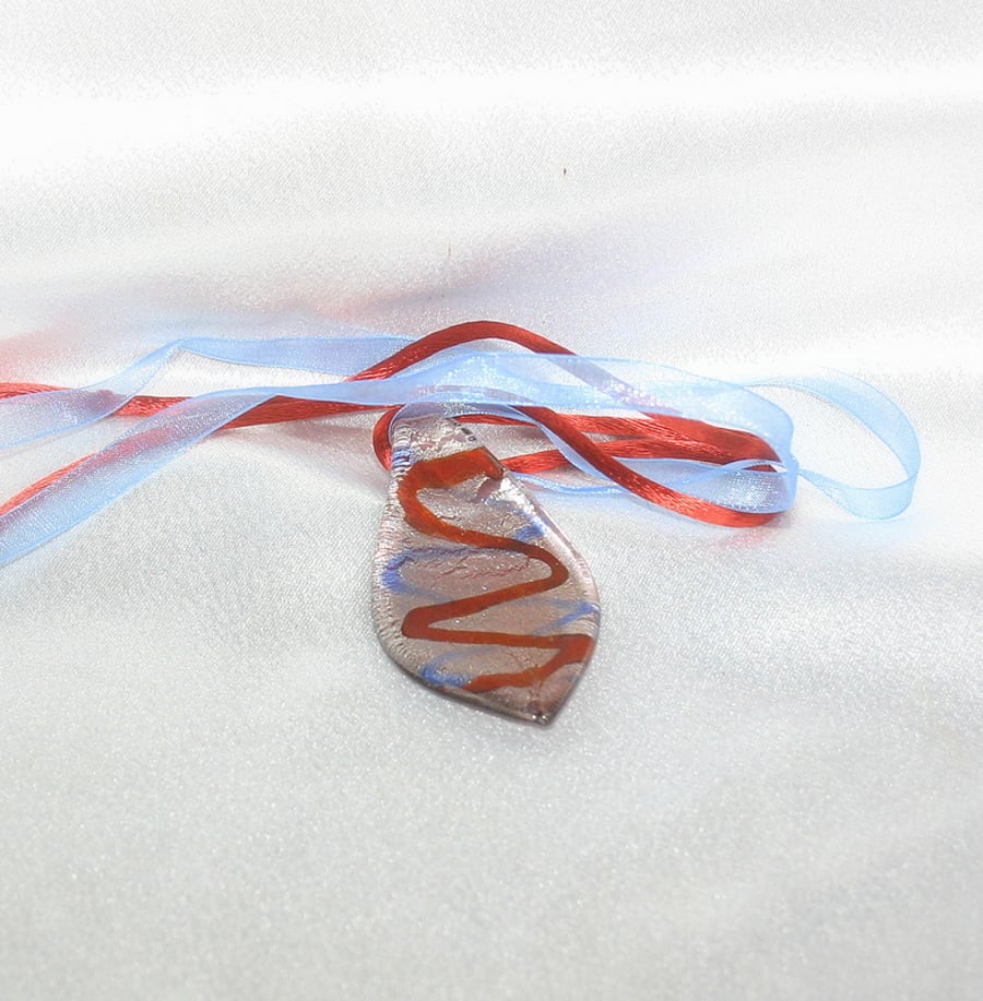 Sale 50% off. Glass pendant strung on blue ribbon and red cord.