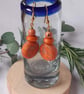 Sparkly orange dangly polymer clay earrings disc shaped earrings