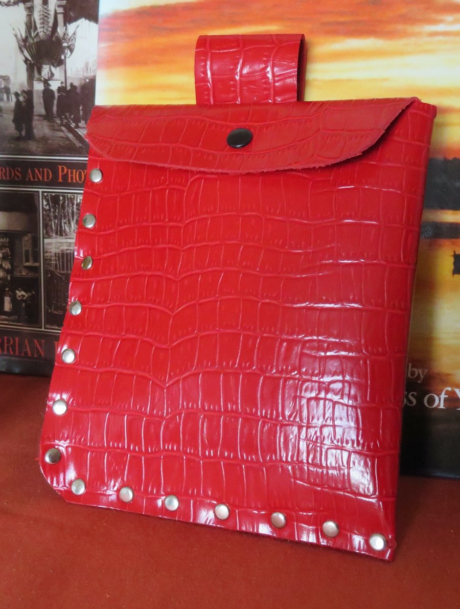 Bright red faux leather studded belt pouch.