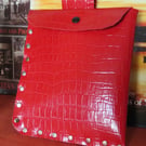 Bright red faux leather studded belt pouch.