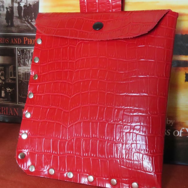 Bright red faux leather studded belt pouch.