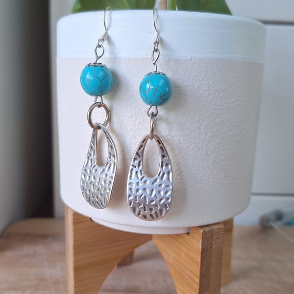 Wrought metal with turquoise beads earrings.
