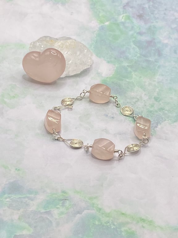 Twisted rose quartz nugget bracelet with wire spiral charms