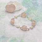 Twisted rose quartz nugget bracelet with wire spiral charms