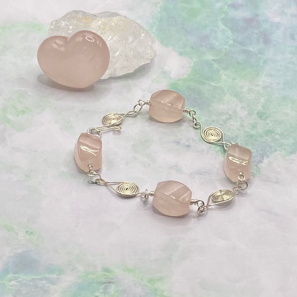 Twisted rose quartz nugget bracelet with wire spiral charms